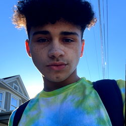 Young Male with Unique Hairstyle Posing for Selfie