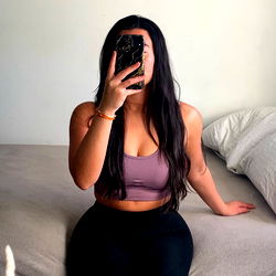 A Fitness Enthusiast Posing in a Bedroom