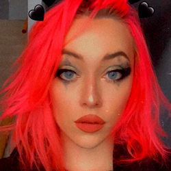 Vivid Pink Hair with Eye Makeup and Neon Green Eyes