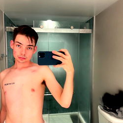 Model in Bathroom Mirror