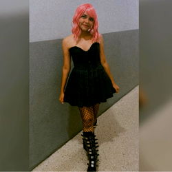 A Model Pose in a Stylish Outfit with Pink Hair