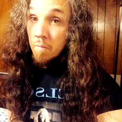 A Man with Long Hair and a Beard