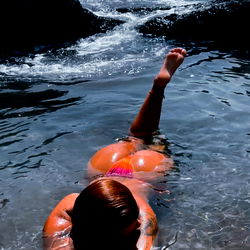 Girl in Bikini Swimming in Ocean