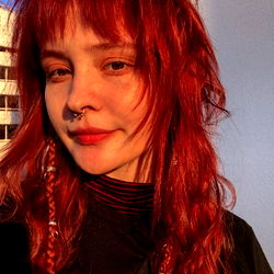 Anya, the Vibrant Emo with Red Hair and a Chic Style