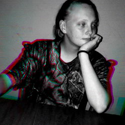 Solemn Girl Pondering at a Table