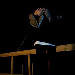 Moody Night Scene with Person Looking Up