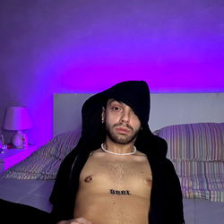 Young Man in Hoodie Lying Down, Awaiting Your Appreciation