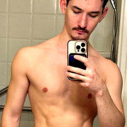 Fitness Model Showcasing Abs and Smartphone