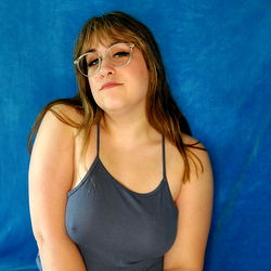 Goddess Alo: Vintage-Inspired Model Poses in Blue Tank Top