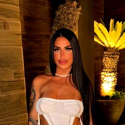 Madiii, a striking OnlyFans model posing in a white bikini