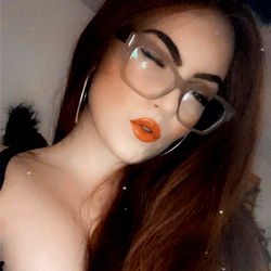Vibrant and Glamorous Model with Orange Lipstick and Glasses