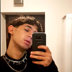 Stylish Anduwu Posing with a Phone