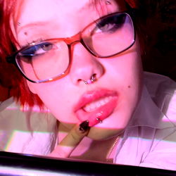 Angel, a vibrant OnlyFans model capturing attention in her unique style