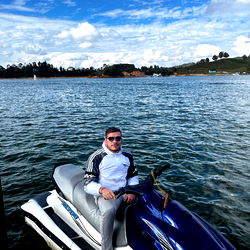 Model on Jet Ski in Lakeside Setting