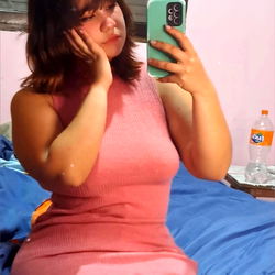 Model in Pink Dress Posing for Photo