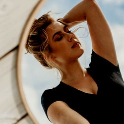 Stylish Model in Front of Mirror