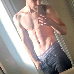 Aesthetic Fitness Model, Andreas, Captures His Shredded physique in the Mirror