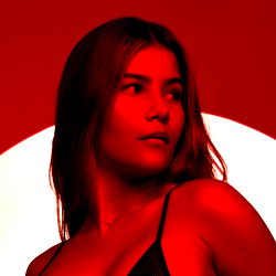 Red-toned portrait of a model against a red background