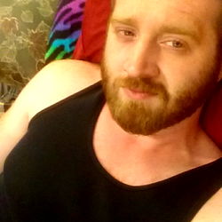 Dustin Pfander, a Bearded Man Relaxing on Couch