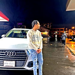 Lil Zoe in Rochester, NY - Standing next to a car