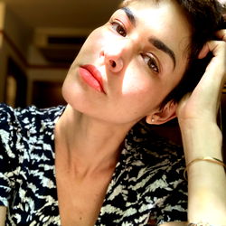 Anahi de Cárdenas in a black and white striped top