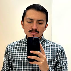 Young Man with Stubble Taking Selfie