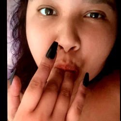 Trixi Pham: OnlyFans Model Making a Daring Lip-Sealing Gesture