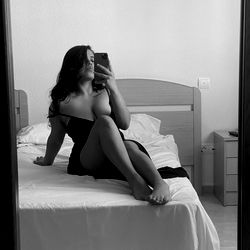 Adult model Alexa Codrintong in a hotel room