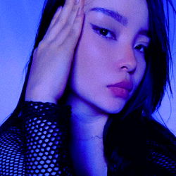 Jey, a captivating OnlyFans model poses with a thoughtful expression.