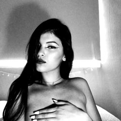 A🤍, a young model with expressive eyes and confident pose. 📸 Model's OnlyFans