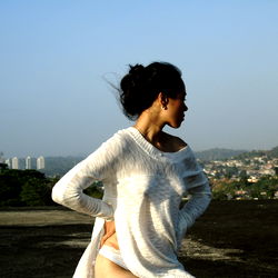 Annaxnasty, a United Kingdom OnlyFans Model in White Shirt and Skinny Jeans