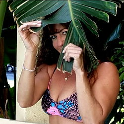 Annie.mariexx Sharing a Playful Moment with Palm Leaves