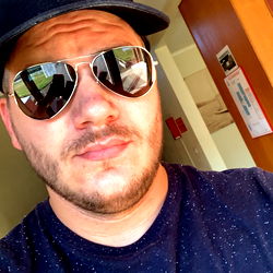 Sunglasses-clad man with a beard