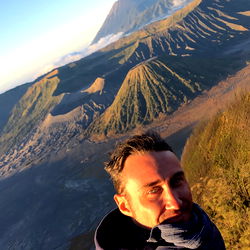 A Man Posing for a Selfie in the Mountains