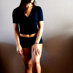 Annie, a fitness enthusiast striking a pose in casual sports attire