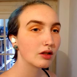 Young Adult Woman with Blue Eyes and Short Hair