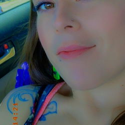 Ashley Nicole, OnlyFans Model, Poses in Sleeveless Tank Top for Photoshoot