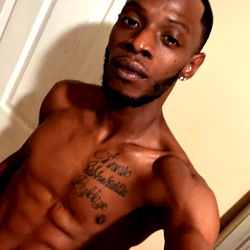 Muscular Man in Tattooed Arm, Bare Chest, and Underwear