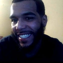 Bearded Man with Short Hair Smiling and Posing