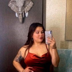 OnlyFans Model Marina from Washington, Striking a Pose in Her Red Dress