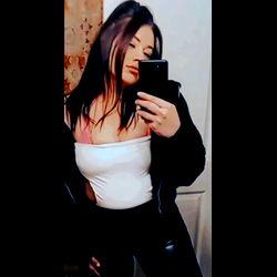 Woman in White Tank Top and Leather Jacket