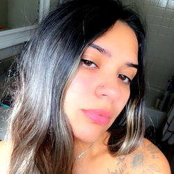 Beautiful Woman in a Bathroom Mirror