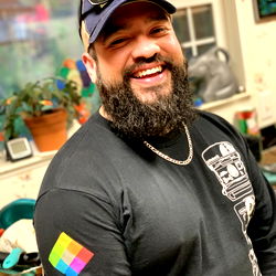 Bearded man in a room with plants