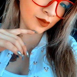 Liz, a young and vibrant individual with a playful pose,