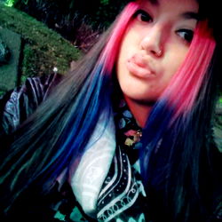 Model Photo of AGUSTINA GONZÁLEZ from Argentina, with vibrant hair and a colorful shirt. OnlyFans model.