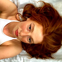Diana, a stunning red-headed OnlyFans model in repose