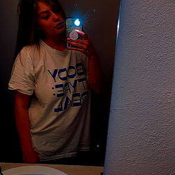 Model in Bathroom Mirror