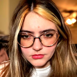 Julia, OnlyFans Model with Blonde Hair and Glasses