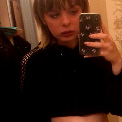 Model in a bathroom mirror