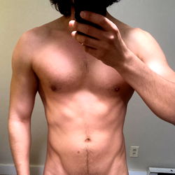 Shirtless Fitness Model Displaying Abdominal Muscles